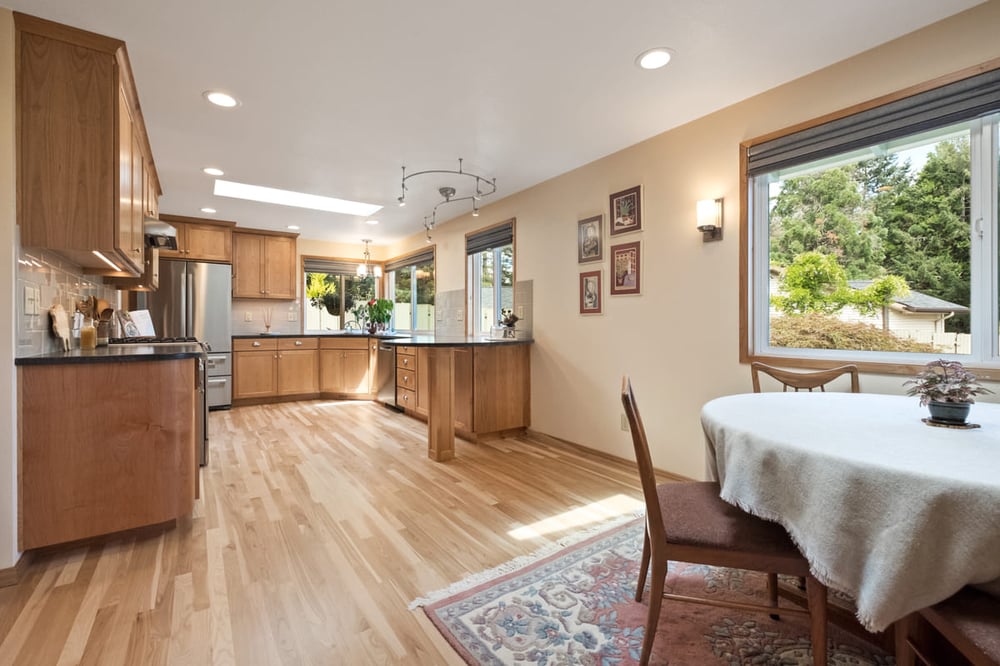 First floor of Corvallis, OR remodel with U-shaped kitchen and skylight above