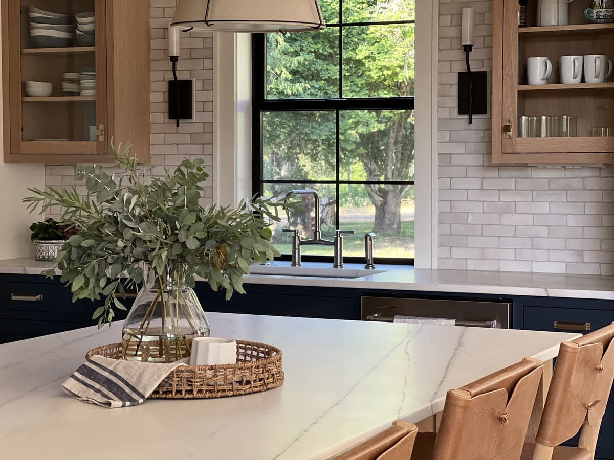 Kitchen and window view in Corvallis, Oregon with island and brick backsplash