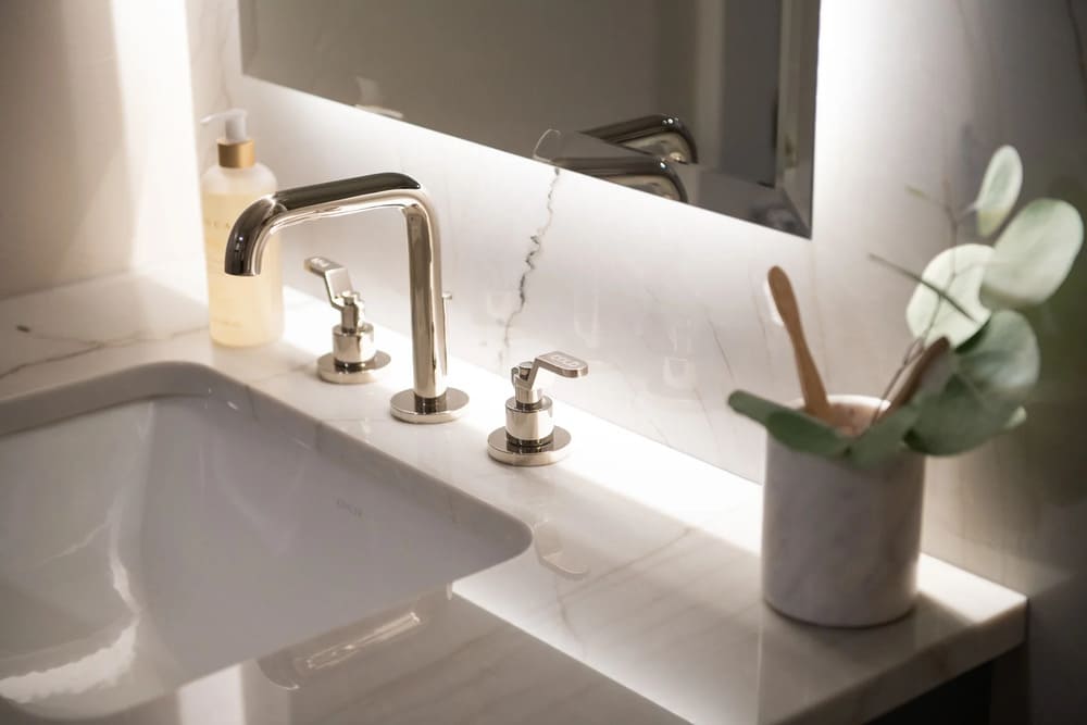 Sweet Home bathroom remodel sink detail with gold fixture Sweet Home bathroom remodel sink detail with gold fixture